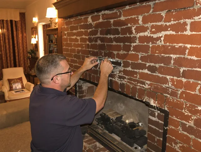 Redlands Chimney Sweep expert fixing a fireplace in Redlands, CA